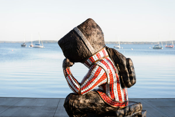 "Well Red," a sculpture by artist Douwe Blumberg of a studious-looking UW-Madison mascot Bucky Badger sitting atop a pile of books, looks out on Lake Mendota from Alumni Park at the University of Wisconsin-Madison during the autumn morning of Oct. 8, 2017. The newly-opened park, part of the Wisconsin Alumni Association (WAA), is located between the Memorial Union and Red Gym (Armory and Gymnasium) overlooking the shoreline.